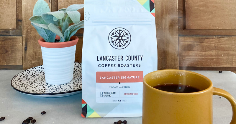 Lancaster Signature Blend Coffee Bag and coffee cup