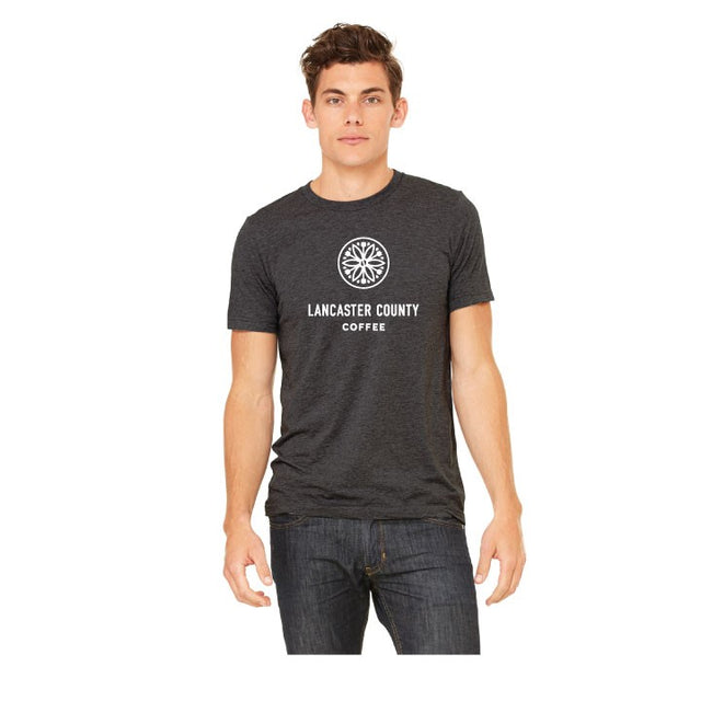 Man wearing heather gray Lancaster County Coffee branded t-shirt.